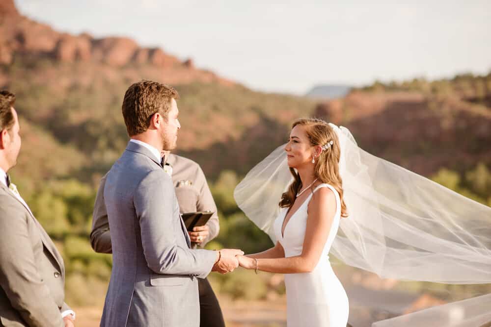 A bride and groom stand together during their wedding ceremony.