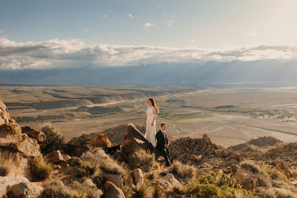 A portrait of the couple with their favorite climbing area behind them.