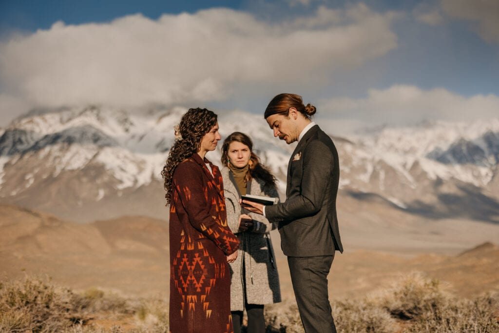The groom reads a piece of literature during the ceremony.