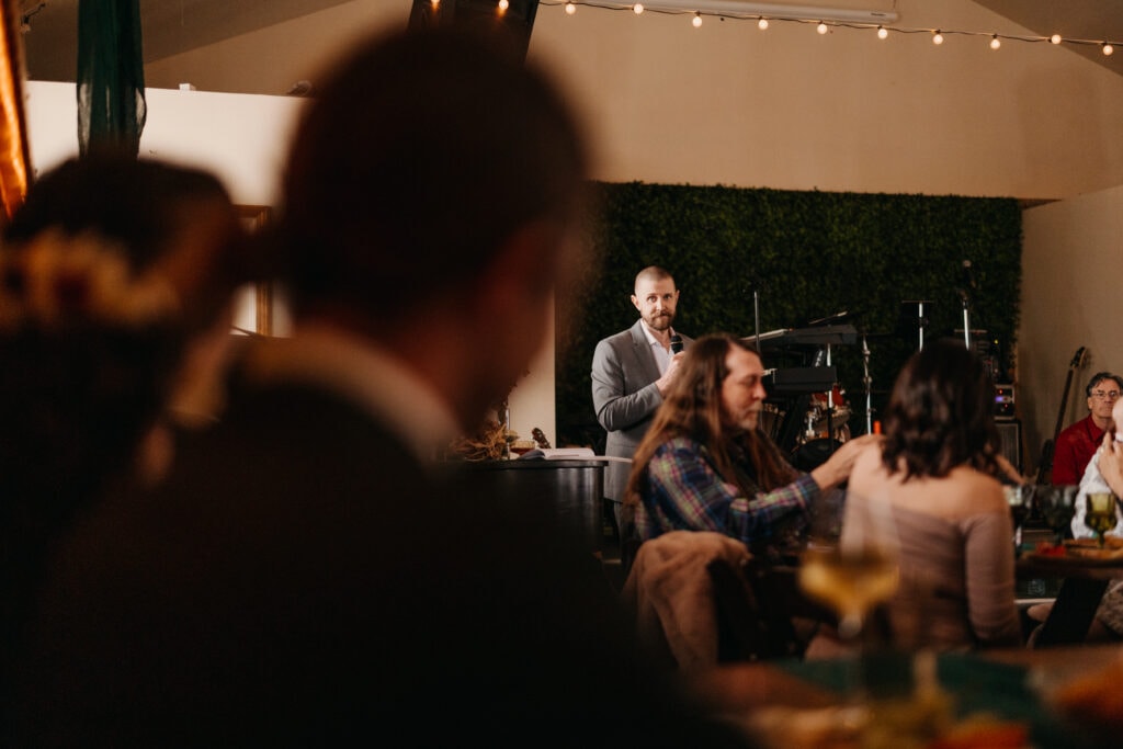 The brother of the groom gives a toast.