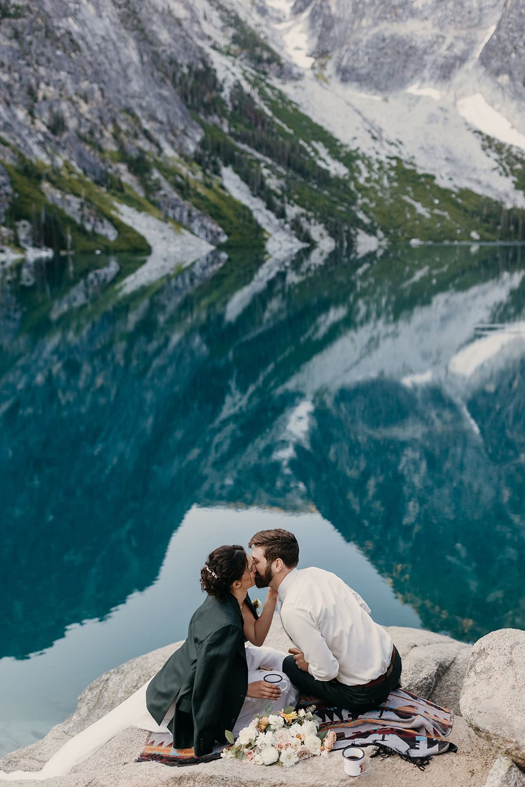A couple shares a kiss after their elopement ceremony in Leavenworth.