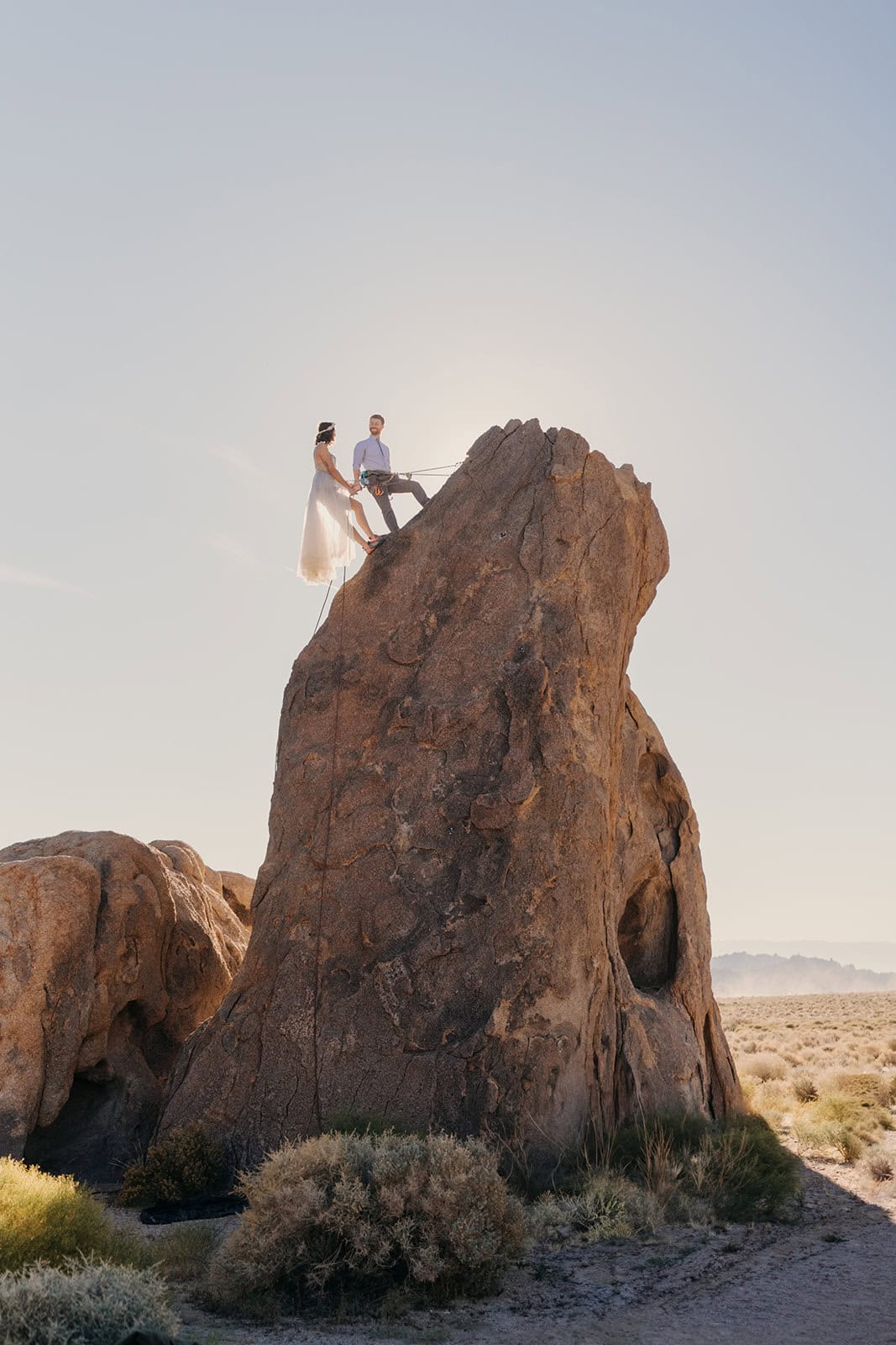 A couple climbs a route together in Alabama Hills on their wedding day.