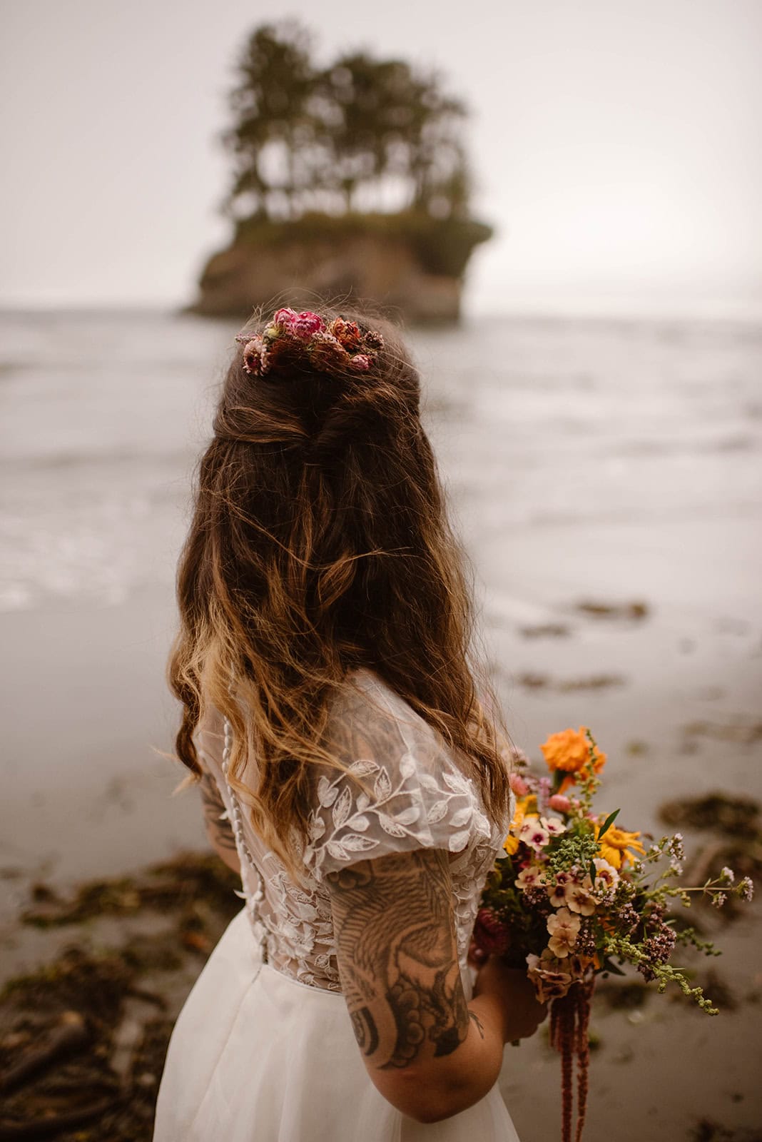 A detail photo of a brides hair mixed in with flowers.