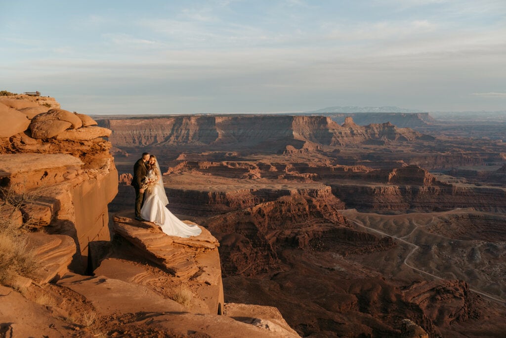 A couple share a kiss as sun starts to set in Dead Horse State Park.