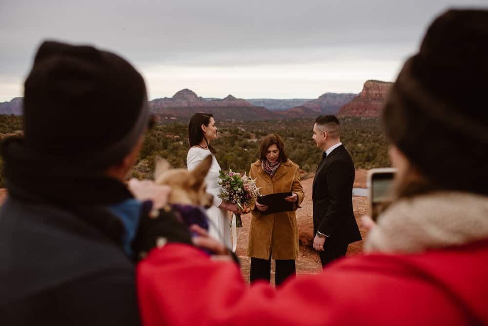 Guests listen as the wedding ceremony happens.
