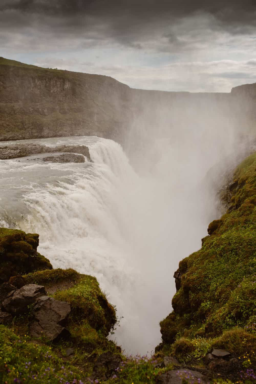 Gullfloss waterfall with mist on a cloudy day.