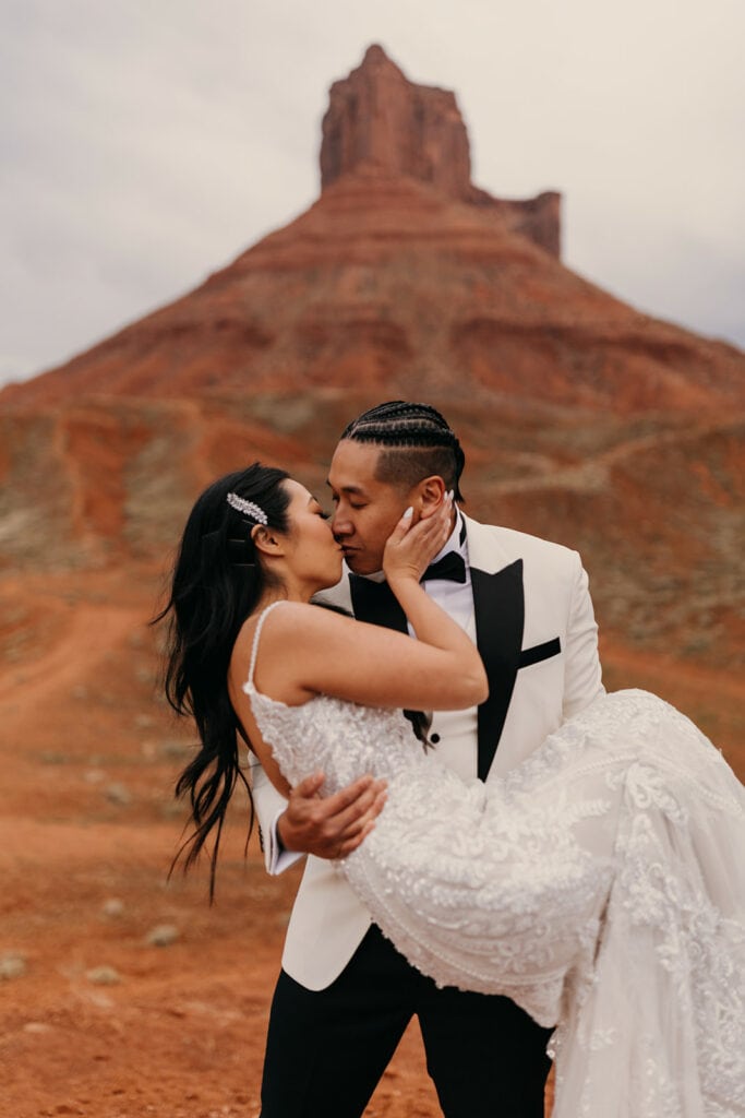 The groom and bride share a kiss. 