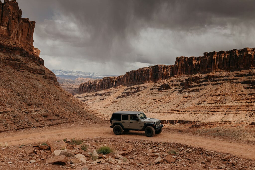The couples off roads together in their jeep.