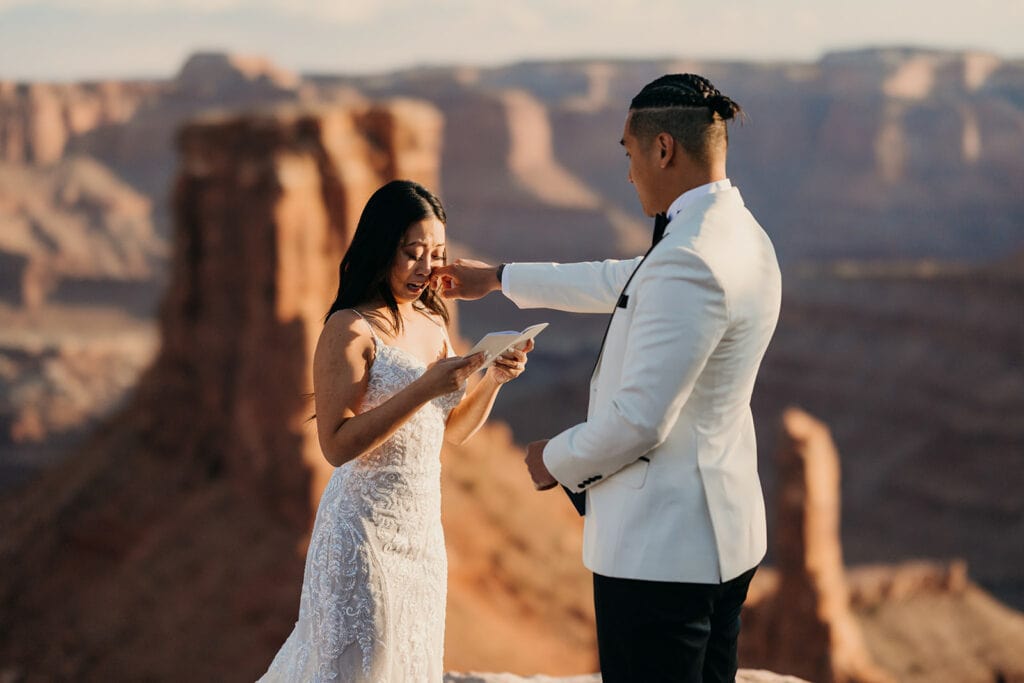 The groom wipes away a tear during the ceremony.