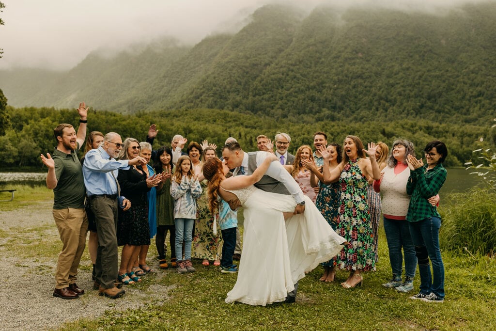 A group photo of the couple and all of their guests.