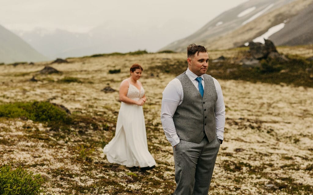 The groom waits to see his bride for the first time.