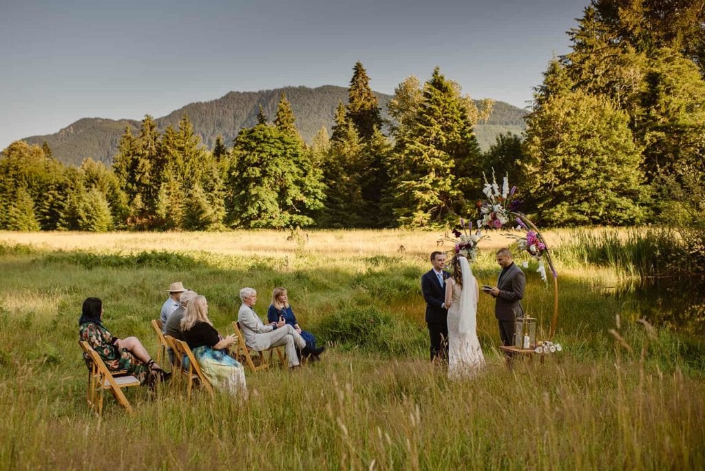 A bride and groom look at each other during their wedding ceremony.
