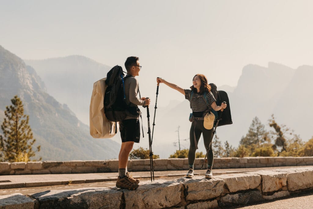 The bride shows excitement at the start of the hike to Taft Point. 
