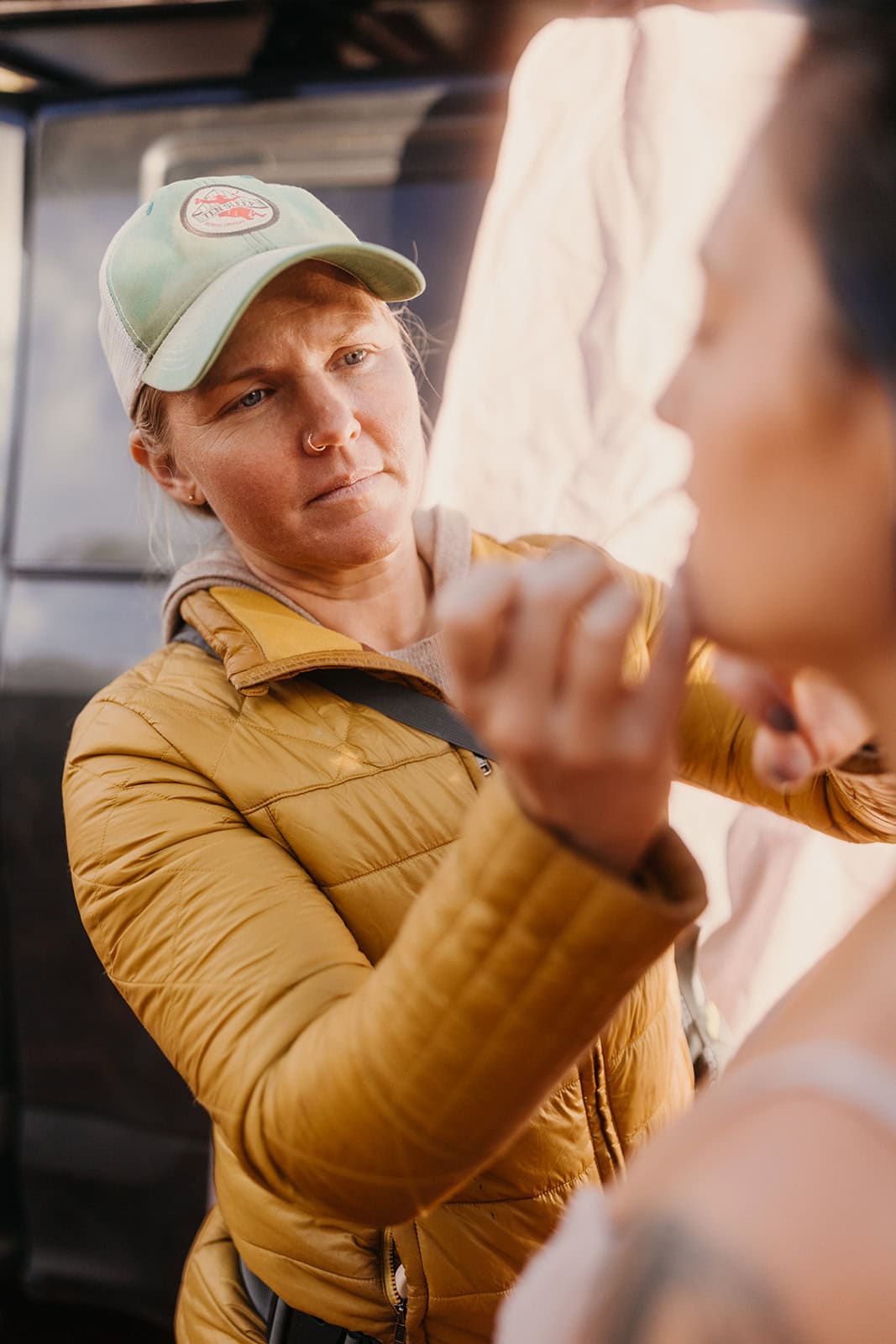 A makeup artist does the brides make up in Moab.