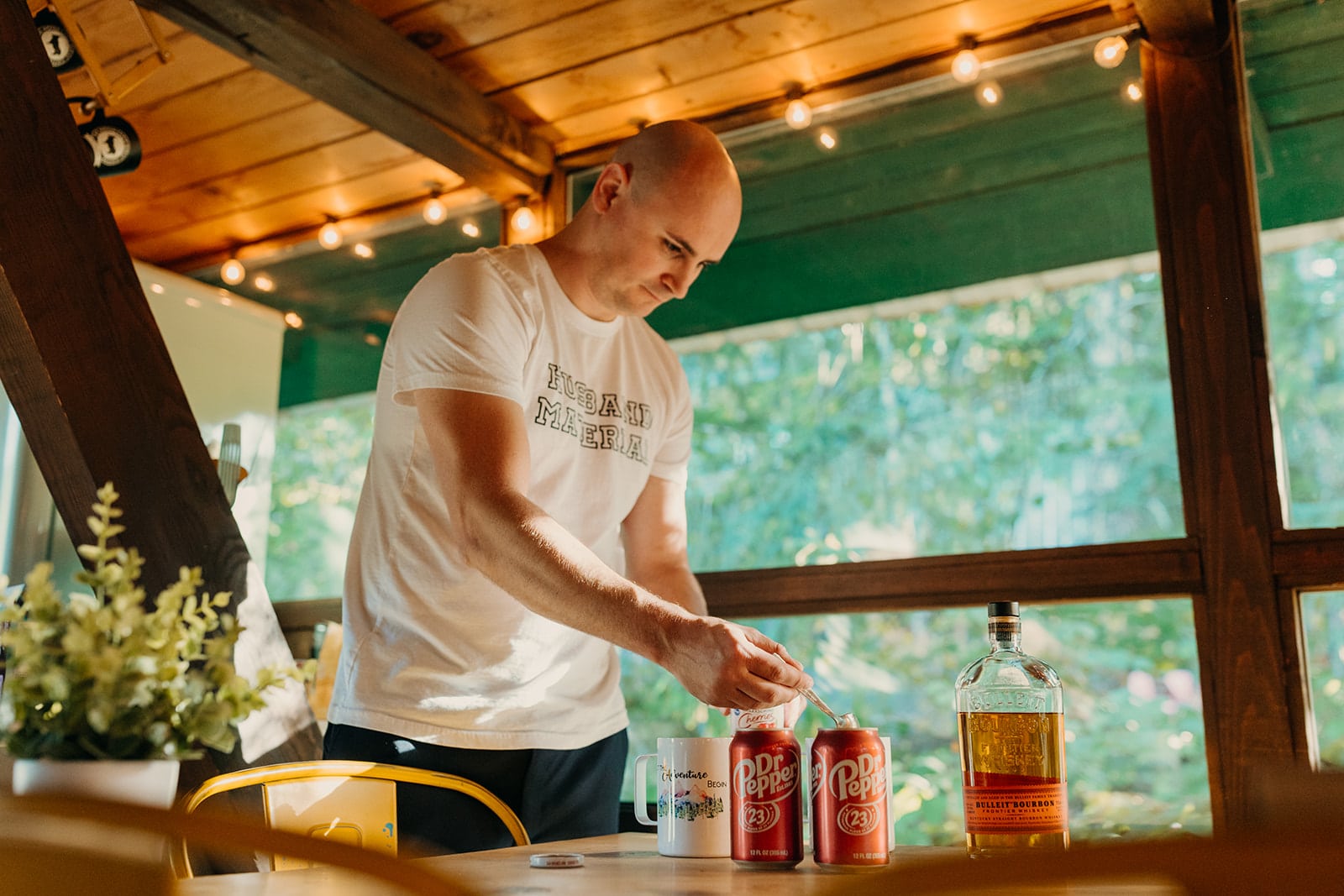 The groom makes cocktails for him and his bride.
