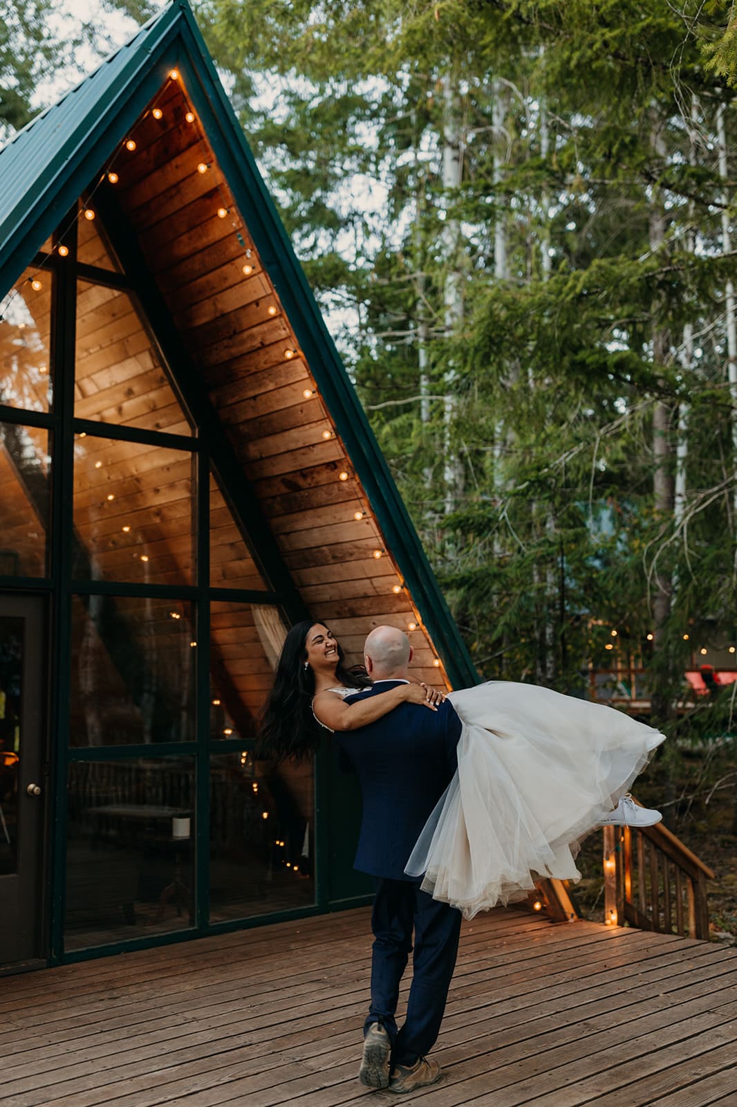 A grooms swoops up his bride during their first dance.