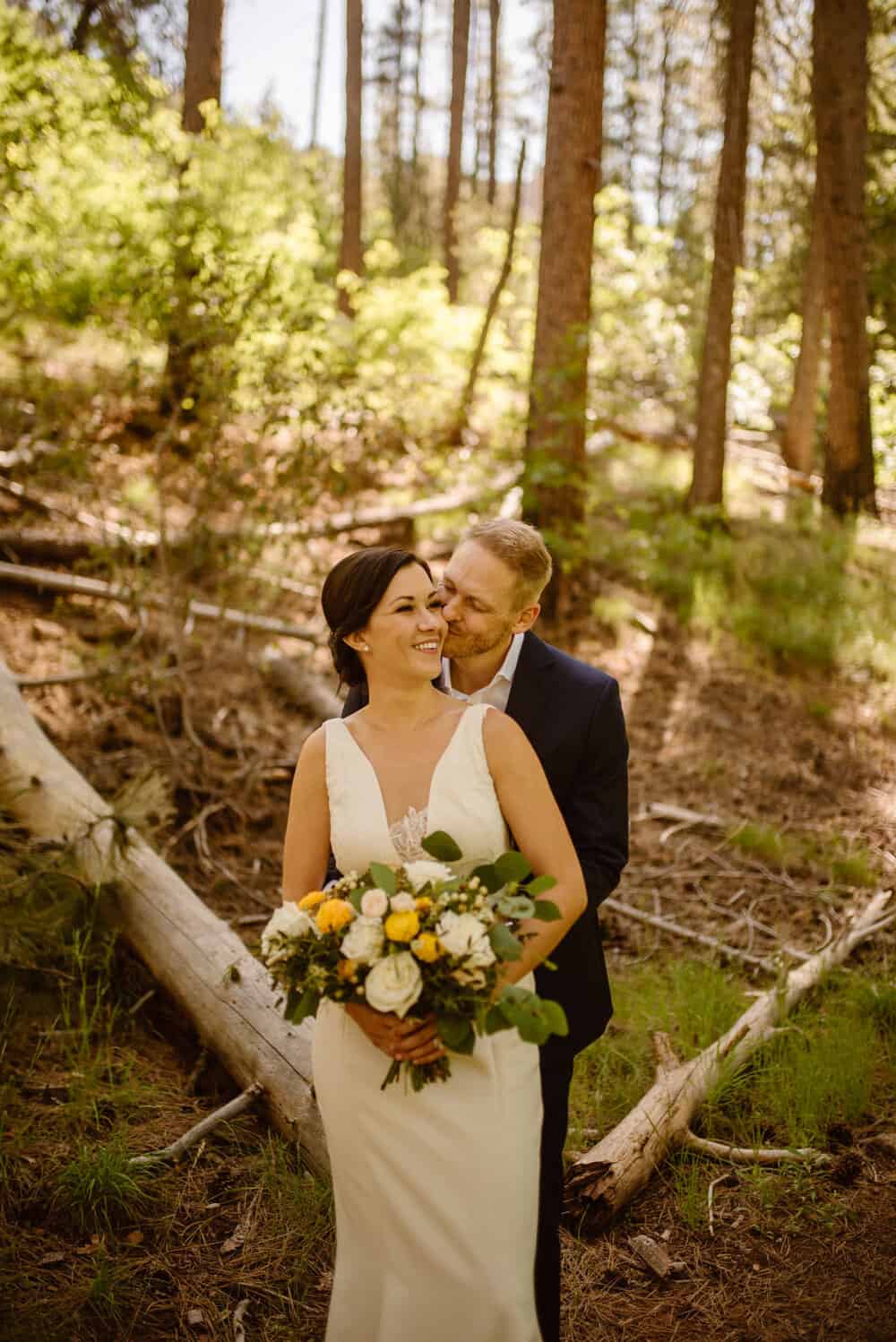 A portrait of the eloping couple as they stand in the forest. 