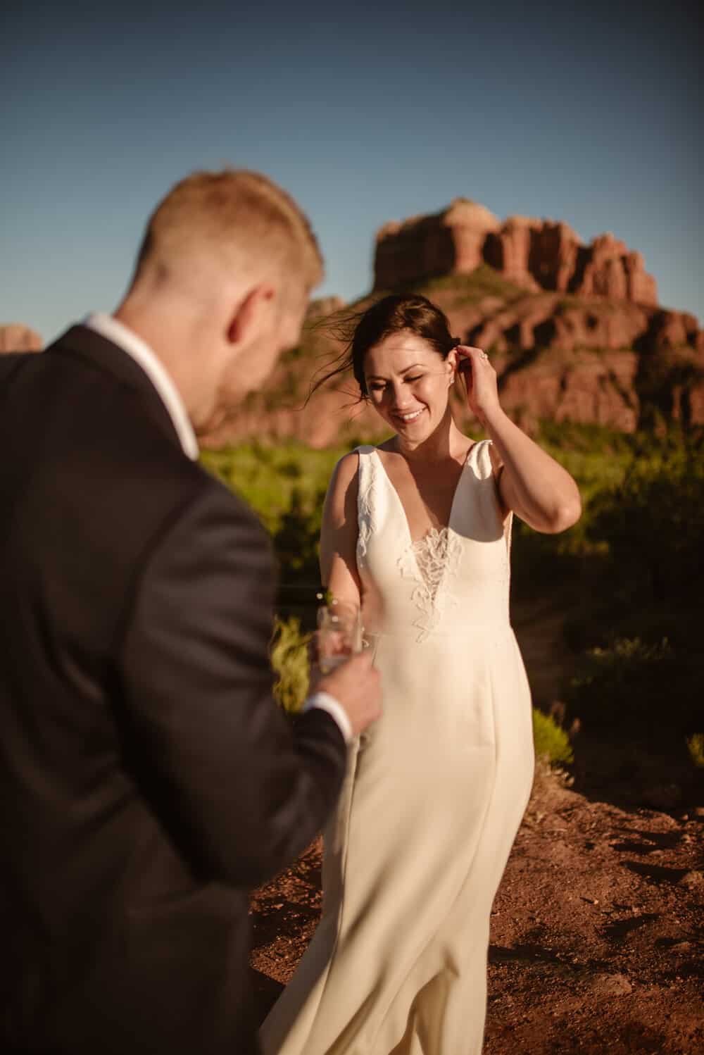 The couple shares a drink and toast at the end of their elopement. 