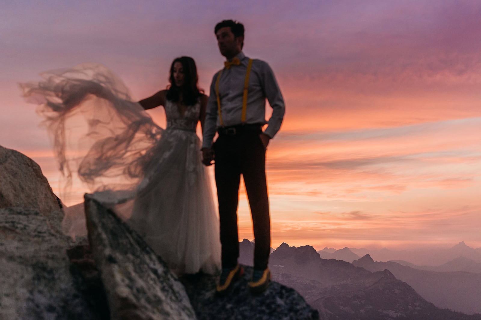 A motion blur photograph of a brides dress flowing in the wind during the end of susnet