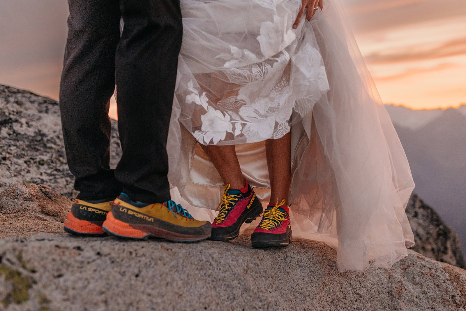 A detail shot of approach shoes under a brides wedding dress and the groom wears his wedding attire.